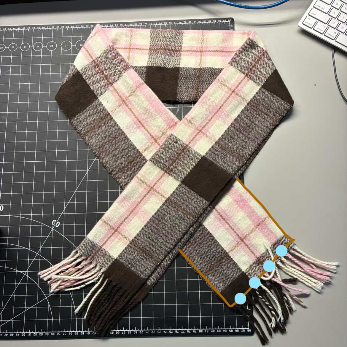 A circuit, that demonstrates a wearable circuit that closes when the scarf closes, and the LED's activate.