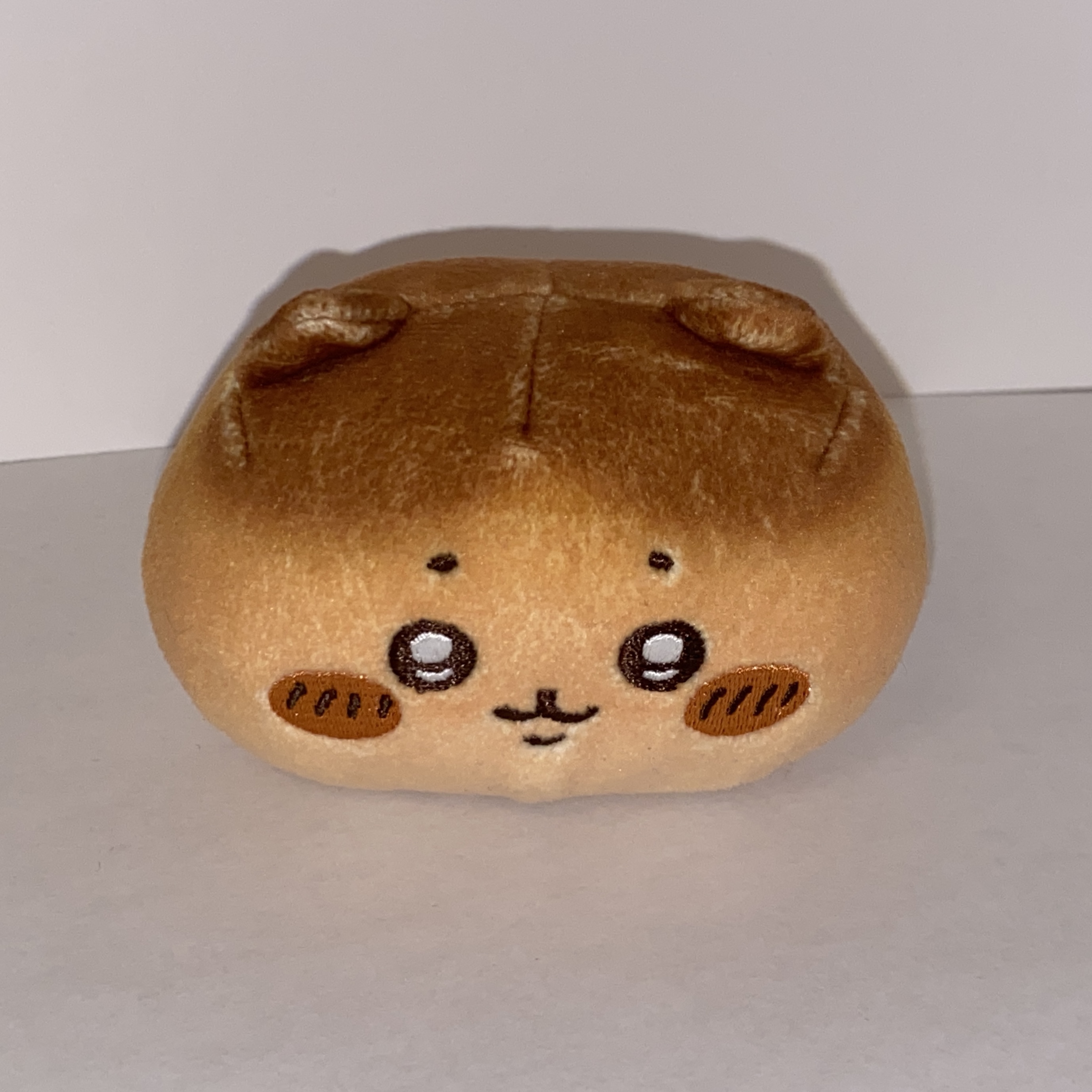 Image of a small round plushie.