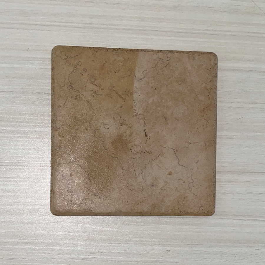 This is an image of a stoneware ceramic tile. It is a rigid material that has been refined through a firing process in a kiln. Stoneware is known for its durability and strength, making it suitable for various applications such as flooring, wall coverings, and countertops.