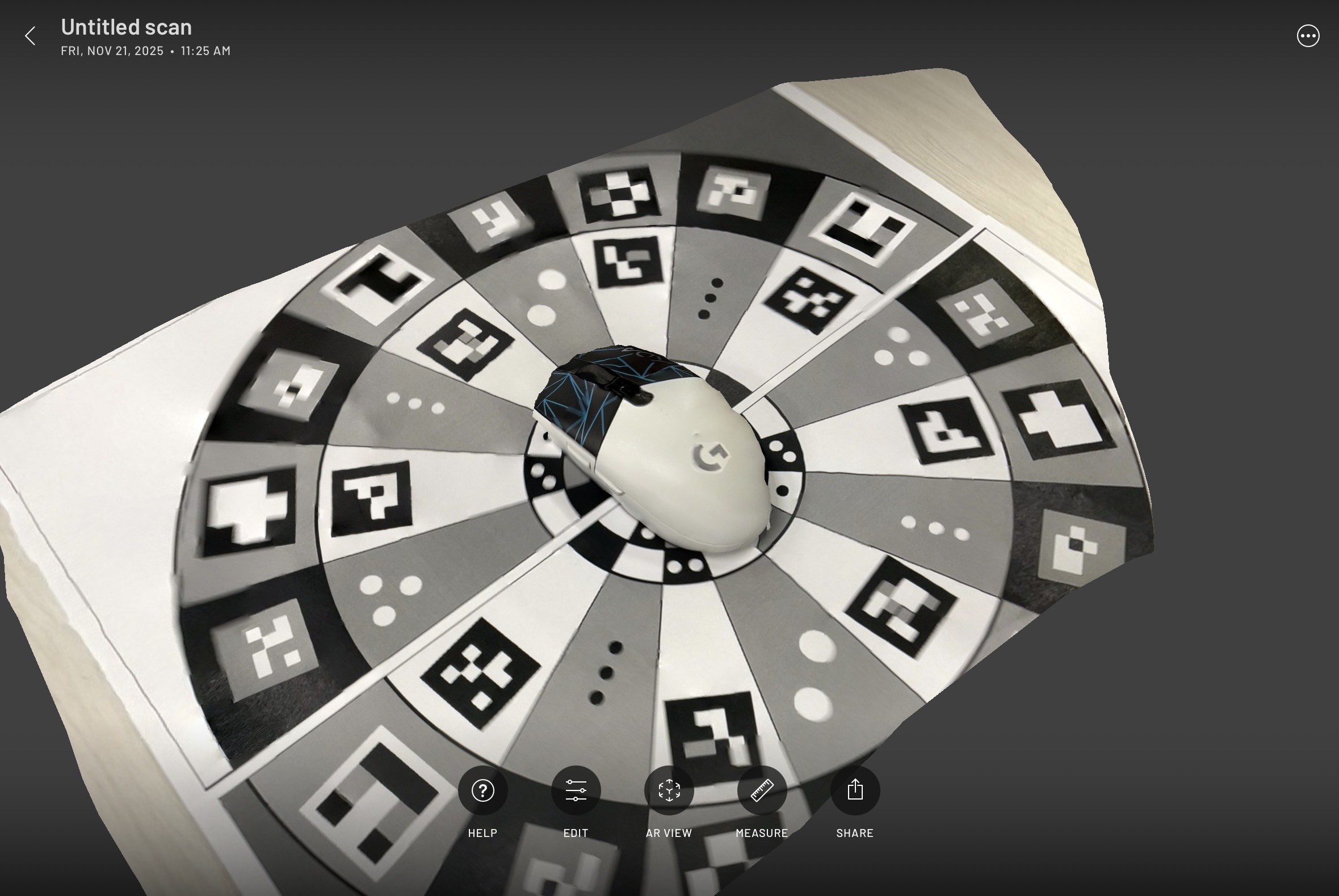 A scan of a mouse. It looks okay from this angle, though some of the texture did not scan properly due to its flatness.